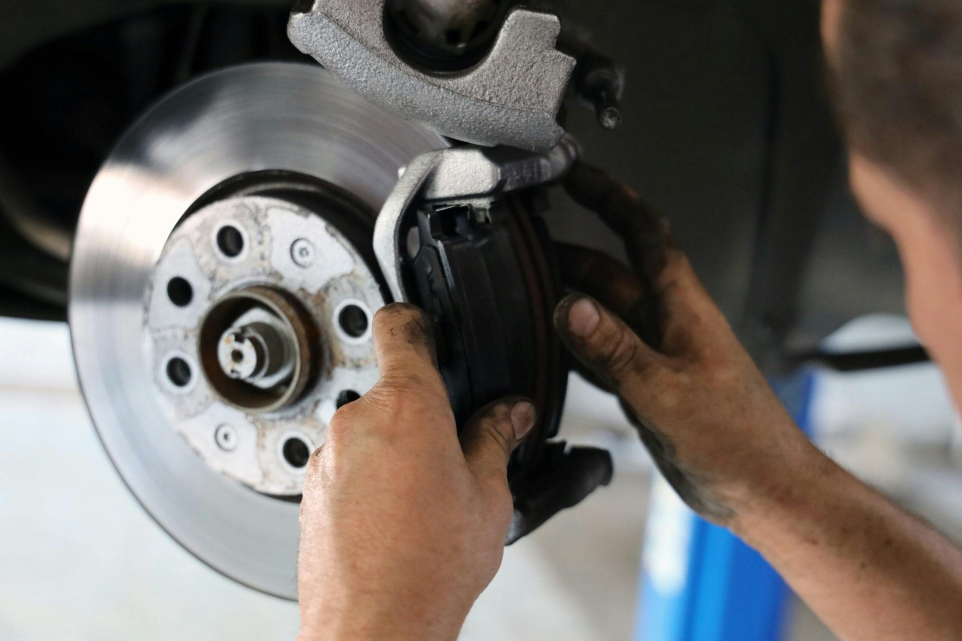 Brake pad installation during brake repair inspection in Fredericksburg VA